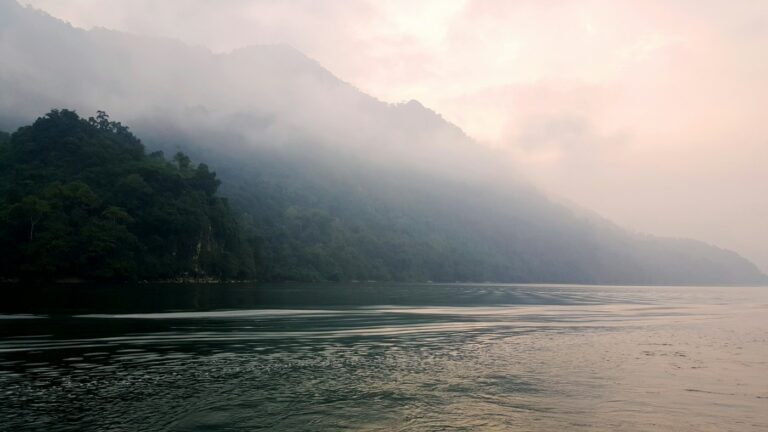 Misty lake and mountains in the morning